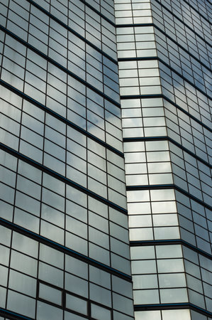 sky being reflected in a glass office building.