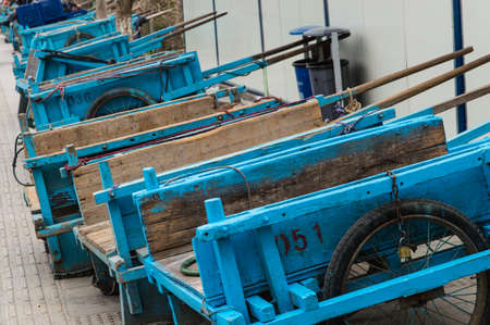 A row of blue wooden handcarts on gulangyu island, Xiamen China
