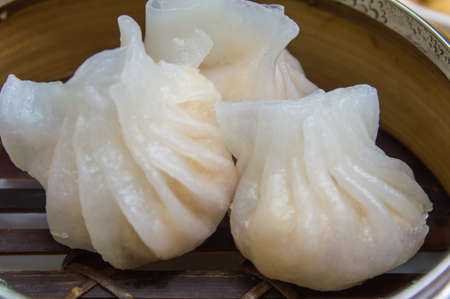 Close-up of dumplings dim sum in a steamer basketの写真素材