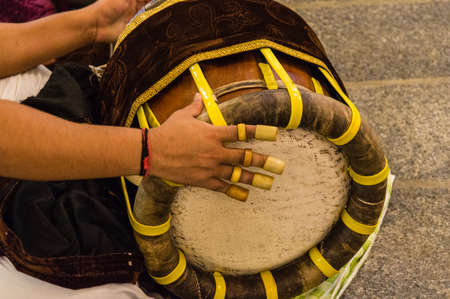 Hand hitting on authentic Indian drumの写真素材