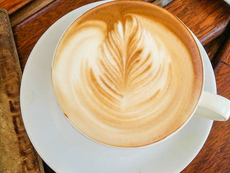 Cup of art latte or cappuccino coffeeの写真素材