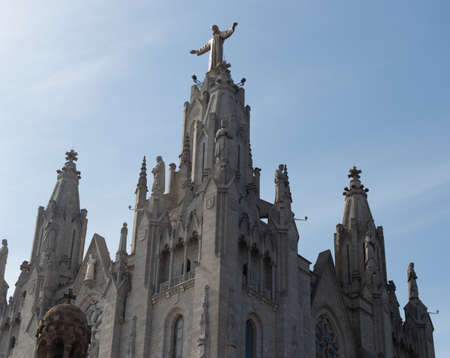 Tibidabo church in Barcelona with statue of Jesus Christ visibleの写真素材
