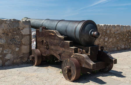 A cannon on the battlements over looking Ibiza Town.の写真素材