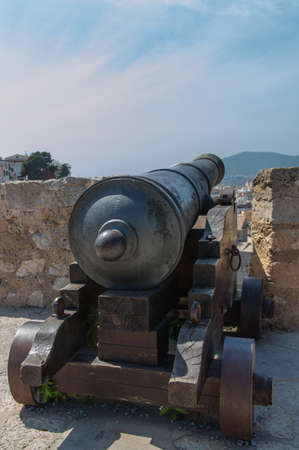 A cannon on the battlements over looking Ibiza Town.の写真素材