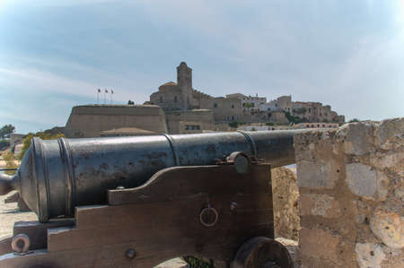 A cannon on the battlements over looking Ibiza Town.の写真素材