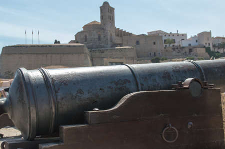 A cannon on the battlements over looking Ibiza Town.の写真素材