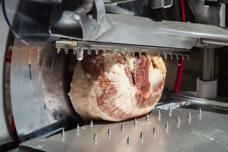 Italian Sausage on Industrial Slicerの写真素材