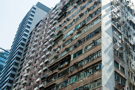 hong kong crowded residential block with so-called Hong Kong Laundry hanging out the windows
