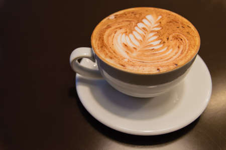 cappuccino cup with drawing on scum