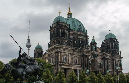 The Berlin cathedral and Fernsehturn television tower stand side by side as respected icons of the city.のeditorial素材
