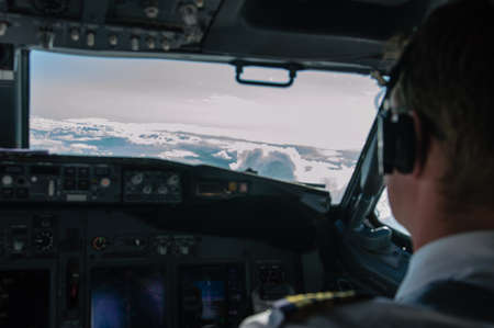 cockpit view of an airplane with a pilotの写真素材