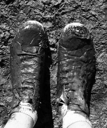 muddy shoes in the tideland at the seashoreの写真素材