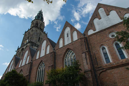Martini-tower (Martinitoren) in Groningen with a cloudy sky on a nice summers day.の写真素材