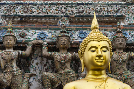 Thai Buddha in front of a stupa.の写真素材