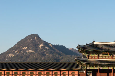 Gyeongbokgung Palace and mountain in the background.のeditorial素材