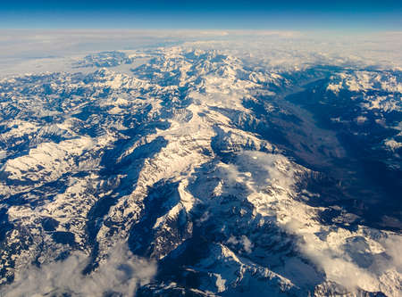 The Austrian Alps in Tyrol seen from above under a beautifull blue sky.の写真素材