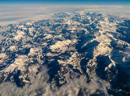 The Austrian Alps in Tyrol seen from above under a beautifull blue sky.の写真素材