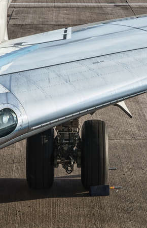 rear landing gear passenger plane on the groundの写真素材