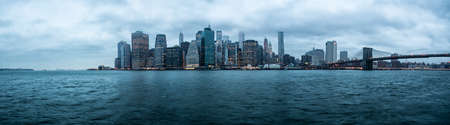 Panorama New York City over the East River towards the financial district in the borough of Manhattan.の写真素材