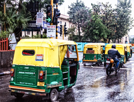 Tuk-tuk on the road in Delhi on March 03 01.2015 in Indiaのeditorial素材