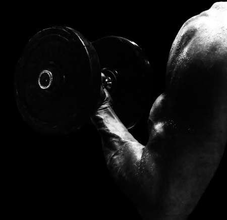 Black and White of a Muscular arm with dumbbellの写真素材
