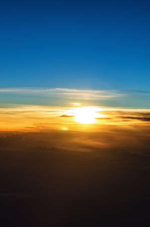 Beautiful sunset above the cloudsの写真素材
