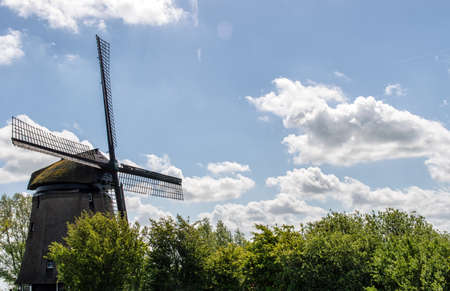 Traditional windmills in dutch landscape in the Netherlandsの写真素材