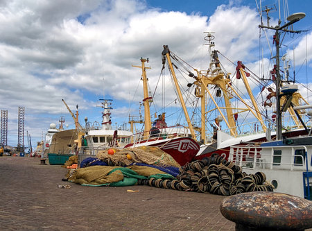 fishing trawler and nets in the harbourのeditorial素材