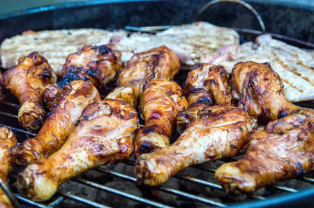 Grilled chicken legs on a bbqの写真素材