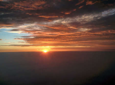 Beautiful Sunset sky from a planeの写真素材