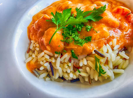 Indian butter chicken on rice.の写真素材