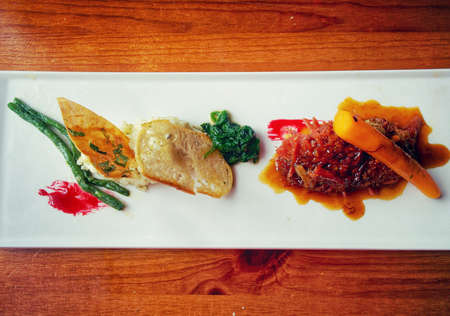 Slow braised beef with carrot,green beans, and condimentsの写真素材