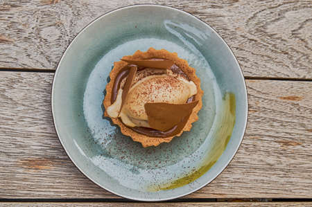 Caramel Sauce  and icecream served on a shell biscuitの写真素材