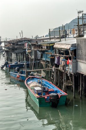 Hong Kong, China - November 30, 2015: Houses on stilts above the tidal flats of Lantau Island are homes to the Tanka people in Tai O, Hong Kong. These unusual structures are interconnected, forming a tightly knit fishing community that literally lives on のeditorial素材