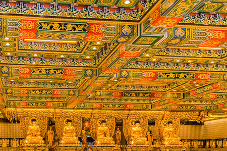 Golden Buddha statues in interior of the temple, Po Lin Monastery. Hong Kong is popular tourist destination of Asia.のeditorial素材