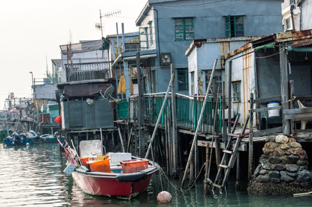 Hong Kong, China - November 30, 2015: Houses on stilts above the tidal flats of Lantau Island are homes to the Tanka people in Tai O, Hong Kong. These unusual structures are interconnected, forming a tightly knit fishing community that literally lives on のeditorial素材