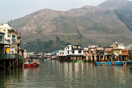 Hong Kong, China - November 30, 2015: Houses on stilts above the tidal flats of Lantau Island are homes to the Tanka people in Tai O, Hong Kong. These unusual structures are interconnected, forming a tightly knit fishing community that literally lives on のeditorial素材