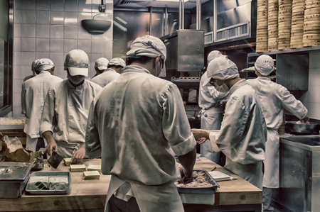 Chinese chefs prepare Dim sum dumplings food at Restaurant in Hong Kong, China.