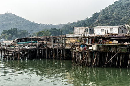 Hong Kong, China - November 30, 2015: Houses on stilts above the tidal flats of Lantau Island are homes to the Tanka people in Tai O, Hong Kong. These unusual structures are interconnected, forming a tightly knit fishing community that literally lives on のeditorial素材