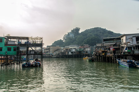 Hong Kong, China - November 30, 2015: Houses on stilts above the tidal flats of Lantau Island are homes to the Tanka people in Tai O, Hong Kong. These unusual structures are interconnected, forming a tightly knit fishing community that literally lives on のeditorial素材