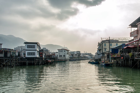 Hong Kong, China - November 30, 2015: Houses on stilts above the tidal flats of Lantau Island are homes to the Tanka people in Tai O, Hong Kong. These unusual structures are interconnected, forming a tightly knit fishing community that literally lives on のeditorial素材