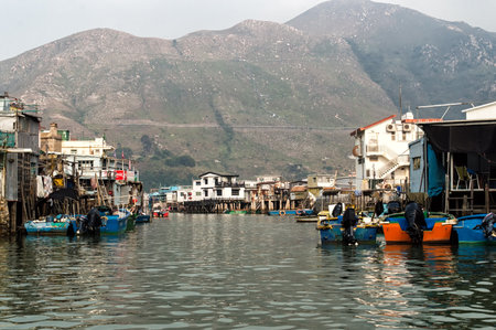 Hong Kong, China - November 30, 2015: Houses on stilts above the tidal flats of Lantau Island are homes to the Tanka people in Tai O, Hong Kong. These unusual structures are interconnected, forming a tightly knit fishing community that literally lives on のeditorial素材
