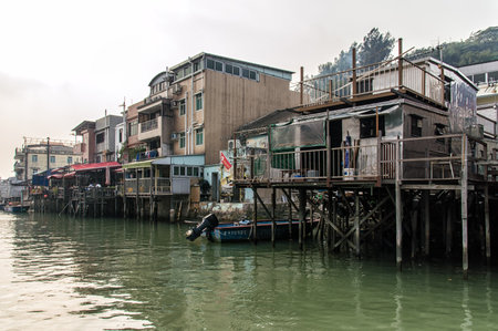 Hong Kong, China - November 30, 2015: Houses on stilts above the tidal flats of Lantau Island are homes to the Tanka people in Tai O, Hong Kong. These unusual structures are interconnected, forming a tightly knit fishing community that literally lives on のeditorial素材