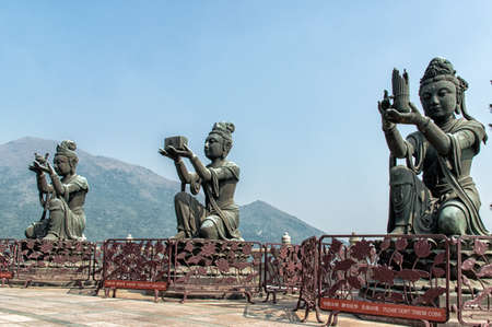 Three Boddisathva statues at Po Lin monastery, Lantau Island, Hong Kong.の写真素材