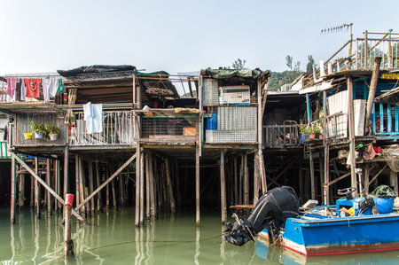 Hong Kong, China - November 30, 2015: Houses on stilts above the tidal flats of Lantau Island are homes to the Tanka people in Tai O, Hong Kong. These unusual structures are interconnected, forming a tightly knit fishing community that literally lives on のeditorial素材