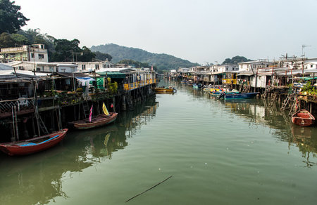 Hong Kong, China - November 30, 2015: Houses on stilts above the tidal flats of Lantau Island are homes to the Tanka people in Tai O, Hong Kong. These unusual structures are interconnected, forming a tightly knit fishing community that literally lives on のeditorial素材