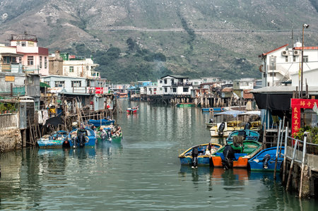 Hong Kong, China - November 30, 2015: Houses on stilts above the tidal flats of Lantau Island are homes to the Tanka people in Tai O, Hong Kong. These unusual structures are interconnected, forming a tightly knit fishing community that literally lives on のeditorial素材