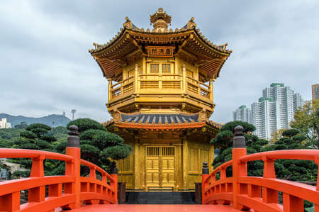 pagoda and red bridge in chinese gardenの写真素材