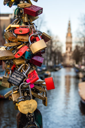 Amsterdam, The Netherlands - January 08, 2016: Locks left as promises to loved ones on the Kloveniersburgwal/Staalstraat Bridge.のeditorial素材
