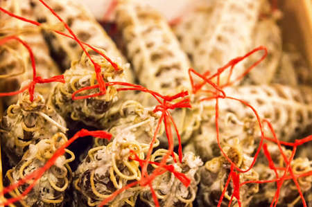 Close up of traditional dry sausages - street market detail.の写真素材